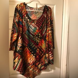 Cato beautiful multi colored shark bite hem top. 3 quarter length sleeves.